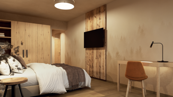 Ein modernes Schlafzimmer mit Holzregalen und einem großen Bett. Ein Schreibtisch und ein Fernseher ergänzen die gemütliche Atmosphäre. - Hotel Garni Hainbacherhof - Sölden