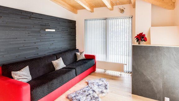 Pension Haus Edmund, Wohnraum mit Ofen Penthouse S - Sölden