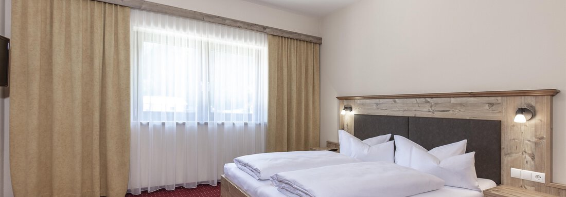 Schlafzimmer_TypÖtztal Schlafzimmer_TypÖtztal - Appartements Panorama - Längenfeld