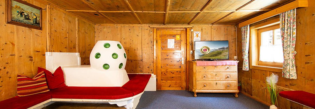 Stube mit Kachelofen | © Johannes Riml, Farmerhouse (CC C) Stube mit Kachelofen - Farmerhouse - Sölden