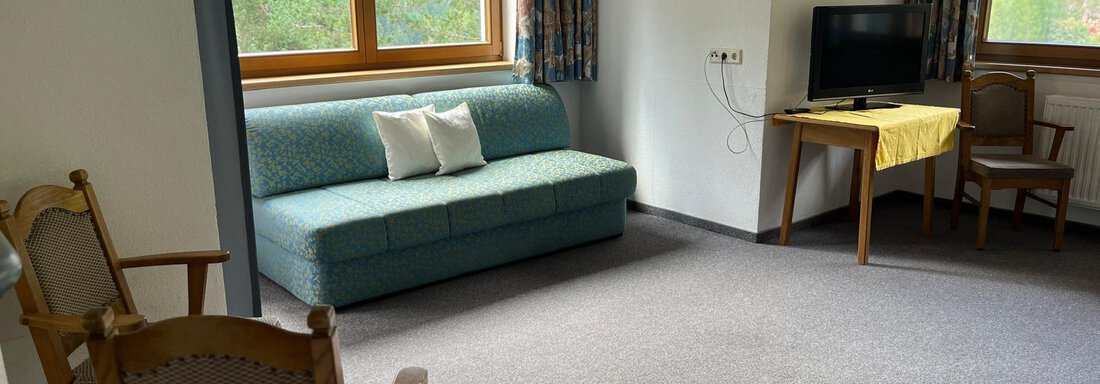 gemütlicher Wohnraum mit Kachelofen - Felsenhäusl - Sölden