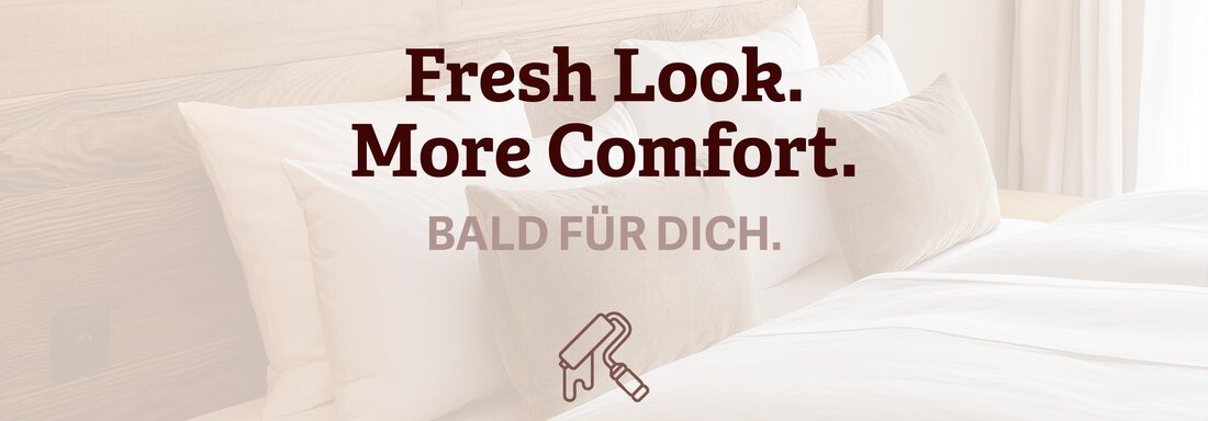 Ein modernes Schlafzimmer mit weißen Bettwäsche und gemütlichen Kissen. Die Wände sind hell und es gibt stilvolle Beleuchtung. - Haus Tanja - Sölden