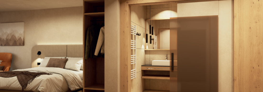 Ein modernes Schlafzimmer mit einem gemütlichen Bett und warmen Holzdetails. Im Hintergrund befindet sich ein elegantes Badezimmer mit Waschbecken und stilvollen Elementen. - Hotel Garni Hainbacherhof - Sölden